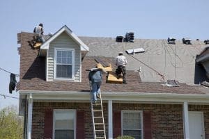 Roofers working on a residential roof.