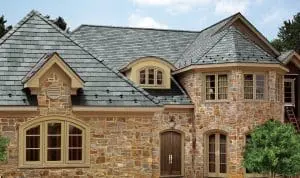 A stone house with a slate roof.