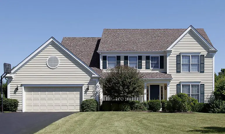 Two-story suburban house with garage.