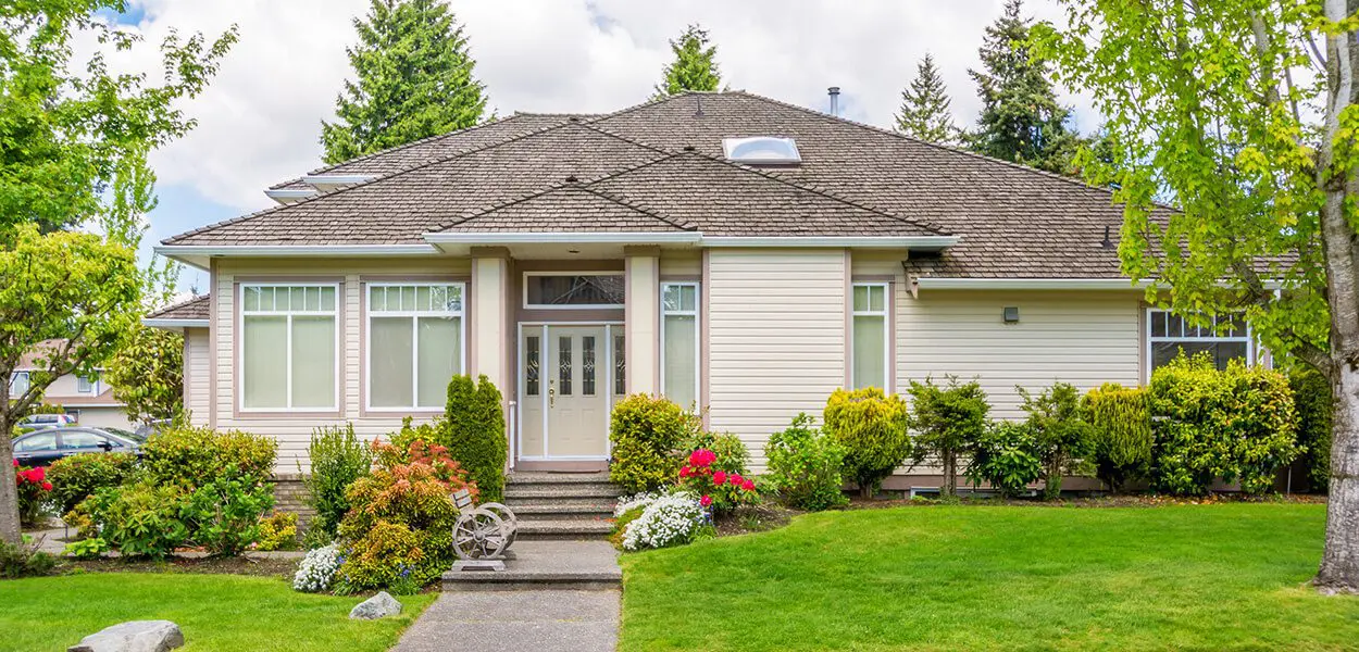 Suburban house with lush green lawn.